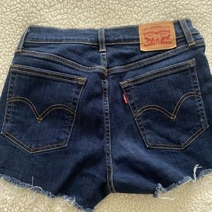 Levi’s high rise cut off dark wash denim shorts